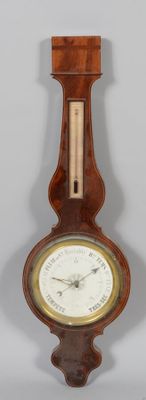 a clock that is hanging on the wall next to a wall clock