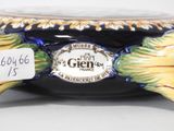 a close up of a vase with a label on it