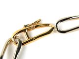 a close up of a gold chain with a clasp on it