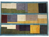 a multicolored rug with squares of different colors and sizes