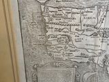 a drawing of a map in a frame on the wall