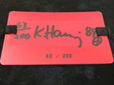 a picture of a red luggage tag with writing on it