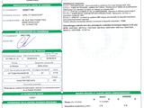 a green and white document with a barcode on it