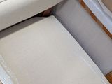 a box that has a chair and ottoman inside of it
