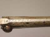 a close up of a metal object with a metal handle