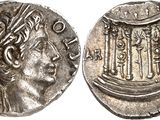 a silver coin with an image of a woman on it