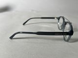 a pair of glasses sitting on a white surface