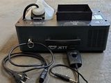 a black box with wires attached to it on the floor