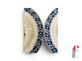 two plates with blue and white designs on them
