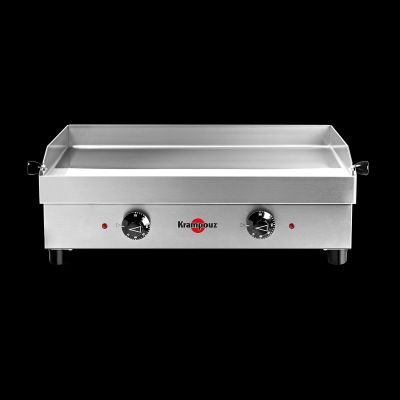 un gros plan d'une plaque de cuisson électrique sur fond noir