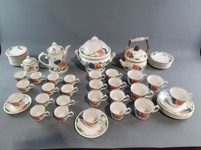 many different types of tea and coffee cups and saucers on the table