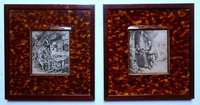 two framed pictures of a man and a woman in front of a building
