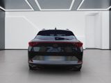 the rear end of a black car in a white room