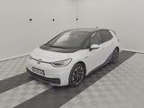the white car is parked in the garage on the checkered floor