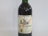 a bottle of wine that is sitting on a table