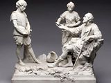 une photo représentant une statue d'un groupe de personnes assises sur un banc