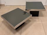 pair of chrome and glass coffee tables
