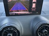 two speakers in the dash of a car with a rear view camera
