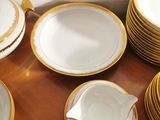 a lot of plates and cups on the table