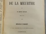 an open book with a black and white image of a man ' s face