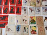 a lot of postcards on the table with pictures on them