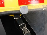 a yellow fire helmet with a black strap on it