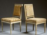pair of chairs with upholstered back and upholstered upholstered seat