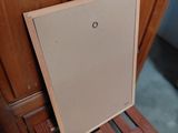 a picture of a wooden chair that has a door open