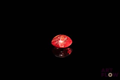 an image of a red diamond on a black surface