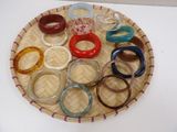 many different colored rings on a tray on a table