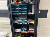 a metal cabinet with many files and papers in it