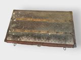 an old suitcase sitting on top of a white surface