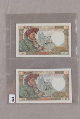 deux billets de banque différents représentant un homme portant un turban et une femme portant un turban