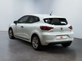 the rear end of a white car parked in a white room