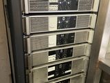 an image of a rack of electronic equipment in a room
