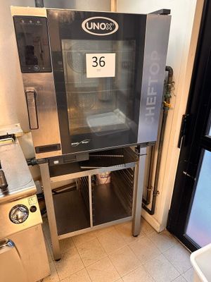 a large oven sitting inside of a kitchen next to a sink