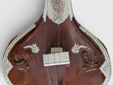a close up of a musical instrument on a white surface