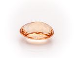 a peach colored diamond on a white background