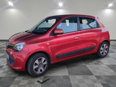 a picture of a red car parked in a garage