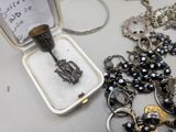 a small box with a bunch of jewelry inside of it