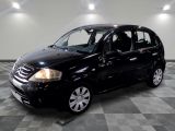 a picture of a small black car parked in a garage
