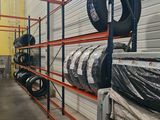 many tires on the shelves in the warehouse
