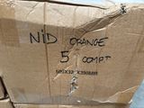 boxes of oranges are stacked on top of each other in a warehouse