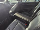 a seat in the back of a car with a tray in it