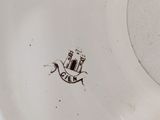 an image of a white plate with a black design on it