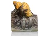 a figurine of a woman with a hat on her head