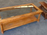 two tables with a glass top and a wooden table with a glass top
