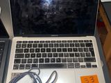two laptops that are sitting on a table