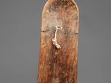 a close up of a skateboard on a gray surface
