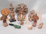 many figurines that are sitting on a white surface